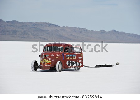 WENDOVER, UT - AUGUST 13: A 1942 Studebaker with its parachute deployed on the Bonneville Salt Flats during Bonneville Speed Week on August 13, 2011 near Wendover, UT.