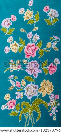 Beautiful rose flower batik fabric on blue background