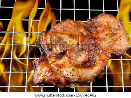 pork chop on the grill with frame