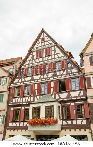 TUBINGEN, GERMANY - JULY 28, 2013: Tubingen is a traditional university town in Germany. The highlights of old town include its narrow alleyways and well-maintained traditional half-timbered houses.