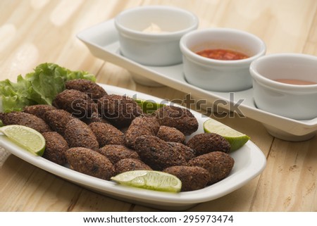 Kibbeh - Middle Eastern minced meat and bulghur wheat fried snack. Also popular party dish in Brazil (kibe)