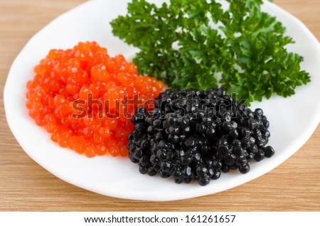 red and black caviar is in a serving plate