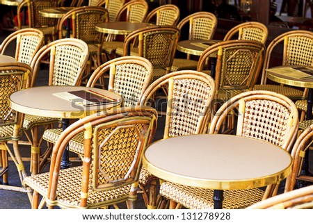 Drucker CafÃ?Â© Chairs in Paris / Rattan-style wicker cafÃ?Â© chairs and tables - place de la Contrescarpe, Paris, France. Those chairs are very French-y, you see them all over the city