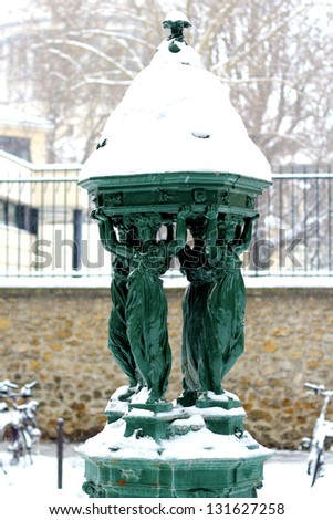 Wallace fountain in Paris by winter / One of the drinking fountains in Paris so called \