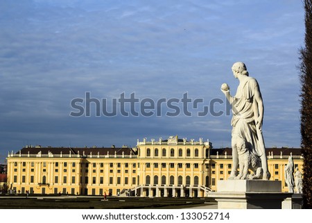 Vienna - Schonbrunn palace against dark blue sky with a statue on the foreground