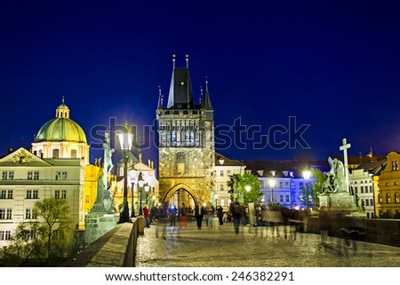 Charles bridge and spires of the old town by night in Prague, Czech Republic.