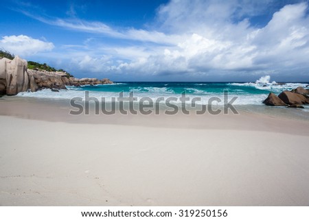 Remote Empty Beach On The Island Of La Digue In The Seychelles