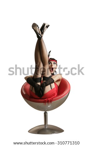 Vintage Pin-up Girl Sitting In a red chair, isolated on white background.