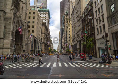 NEW YORK CITY - AUGUST 30, 2014: Pedestrian crosswalk at intersection of Fifth Avenue and 53rd Street, NYC