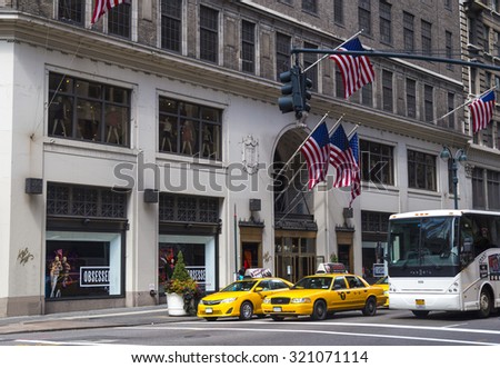 NEW YORK CITY - AUGUST 30, 2014: Traffic in New York City with famous yellow-coloured taxi cabs passing by