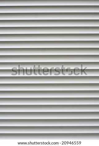 White shutters over a shop doors