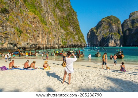 PHI PHI ISLAND,THAILAND-FEBRUARY 25, 2014:Tourists on the wonderful Maya beach of Phi Phi Leh island Thailand on 25 February, 2014.