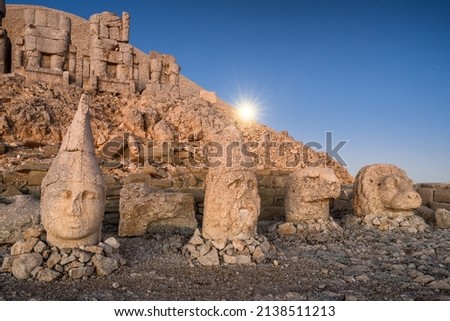 Antique statues at sunrise on Nemrut mountain in Turkey. Ancient stone head close-up at the top of 2150 meters high Mount Nemrut, Eastern Anatolia, Turkey ストックフォト © 