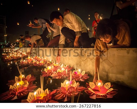 Chiang Mai, Thailand - November 8, 2014: People float lanterns in the river to worship river goddess in Loy Kratong festival on November 8, 2014 in Bankok, Thailand.