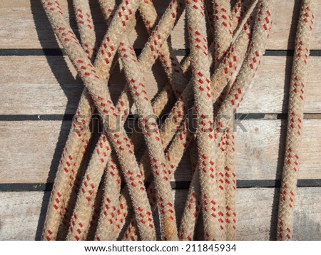 detail of ships rope with teak deck behind