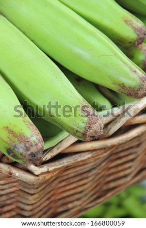 Green raw banana banana on market
