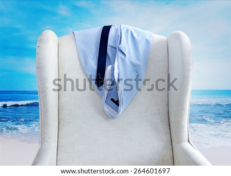 shirt and tie hanging on a chair