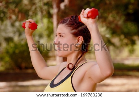 Young Woman Aerobics Instructor with set of weights 4