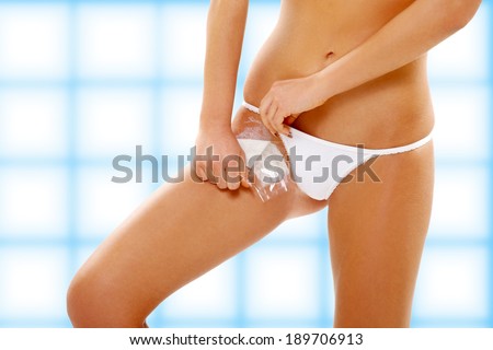 Young woman waxing her belly, hair removal, groin 2