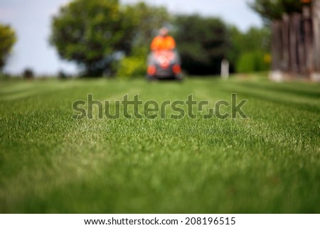 man with lawn mower 3