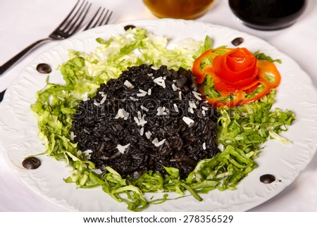 Black Risotto; The color in Obtained Cooking the Rice with the Squids Ink. Selective Focus