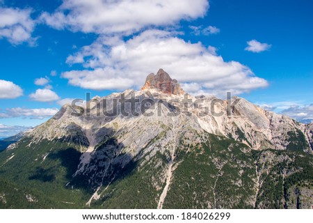 Lonely mountain rises above the forest, Cortina d\'Ampezzo, Italy