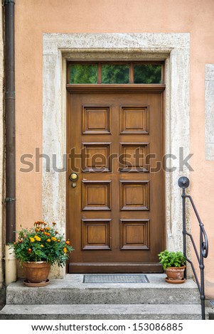 Front door in a german town with decorative flowers