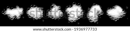 Pieces of soap foam with bubbles isolated on black background. Sparkling shampoo and bath lather vector illustration.