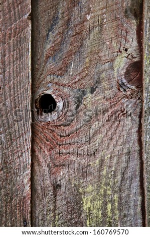 Old wooden barn with wood grain texture. Closeup view for textured background. Wood texture from old barn