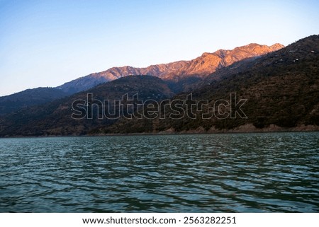 Similar – Image, Stock Photo Sunlight illuminating top of snowy mountain ridge in winter