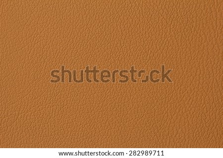 Seamless brown leather texture background surface closeup