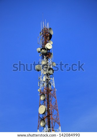 Radio, telephone, television, transmitter and receiver tower with clear blue sky on high technology communication