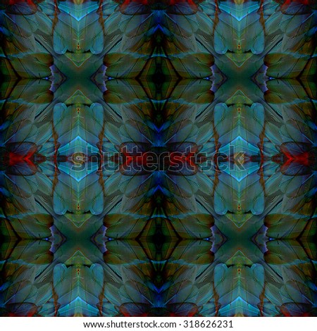 Seamless dark green blue and red background made from the beautiful texture of blue and gold macaw\'s bird feathers