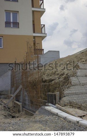 Construction of a new wall, preparing steel rods to concrete.