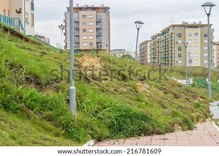 Landslide in a urban area after powerful flood. Selective focus.