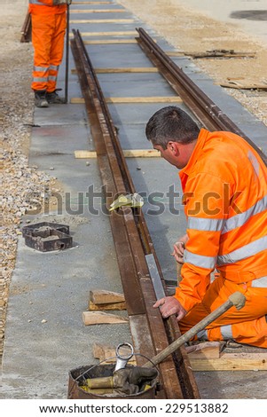 BELGRADE, SERBIA - OCTOBER 28: Preparation for rail welding process. Align two pieces of railroad track before welding. At street Vojvode Stepe in October 2014.