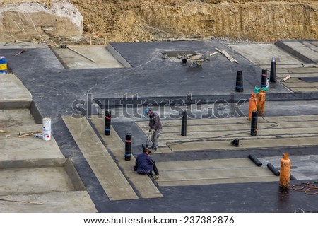 BELGRADE, SERBIA - OCTOBER 30: Foundation insulation to reduce slab heat losses and waterproofing. At construction site in October 2014.
