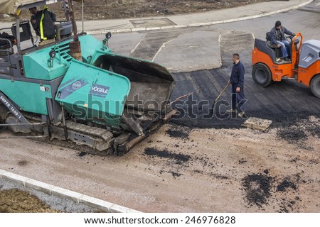 BELGRADE, SERBIA - JANUARY 21: Road construction crew resurface road. At road construction site in January 2015.