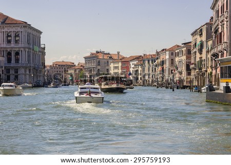 VENICE, ITALY - JUNE 30, 2015: View from Grand Canal on transportation in Venice, moving water buses and boats. Moving in Venice, colored photo.