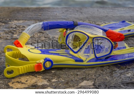 POREC, CROATIA - JULY 03, 2015: Snorkeling equipment, mask, snorkel and fins at the beach.