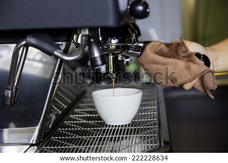 Coffee is pouring a glass of coffee machines.