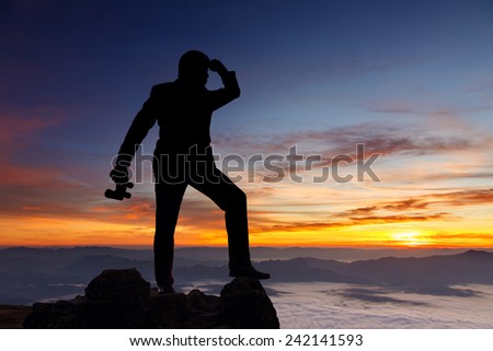 Mountain silhouette businessman