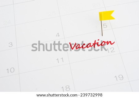 Push pin on a calendar- vacation