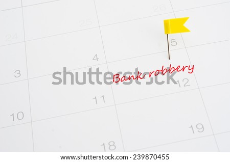 Push pin on a calendar- Bank robbery
