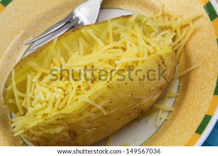 Jacket potato with cheese, close up