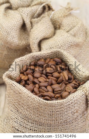 Coffee beans in jute bag, close up