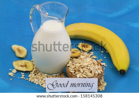 Good morning card with oatmeal, banana, banana chips and jug of milk on blue background