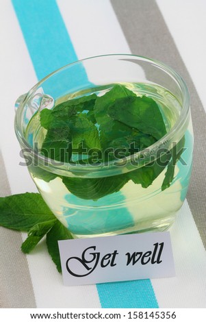 Get well card with glass of hot mint tea