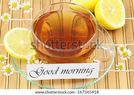 Good morning card with cup of tea, chamomile flowers and lemon
