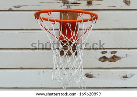 Basketball ring on old white wood
